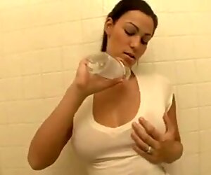 young adults rubs her hugh boobs with gas